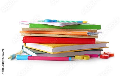 Stack of notebooks and books on white background. Doing homework