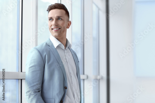 Portrait of young man in of...