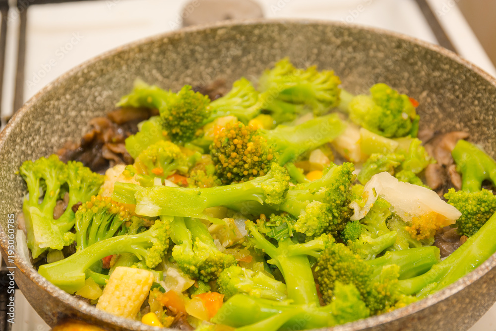 Vegetables are fried in a pan. Preparation of vegetables. vegetables stew. Vegetables are fried in a pan. Preparation of vegetables. vegetables stew.