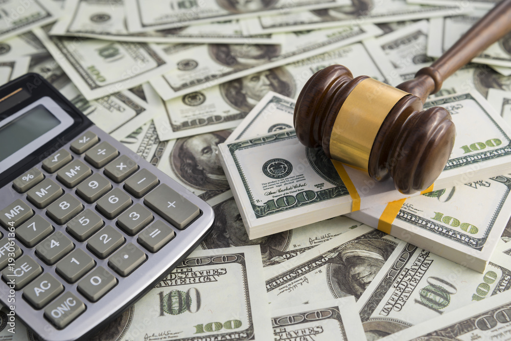 Fototapeta premium Gavel hammer judge money dollar calculator. financial concept, bribe, corruption. Business, court, law. Arrival and punishment