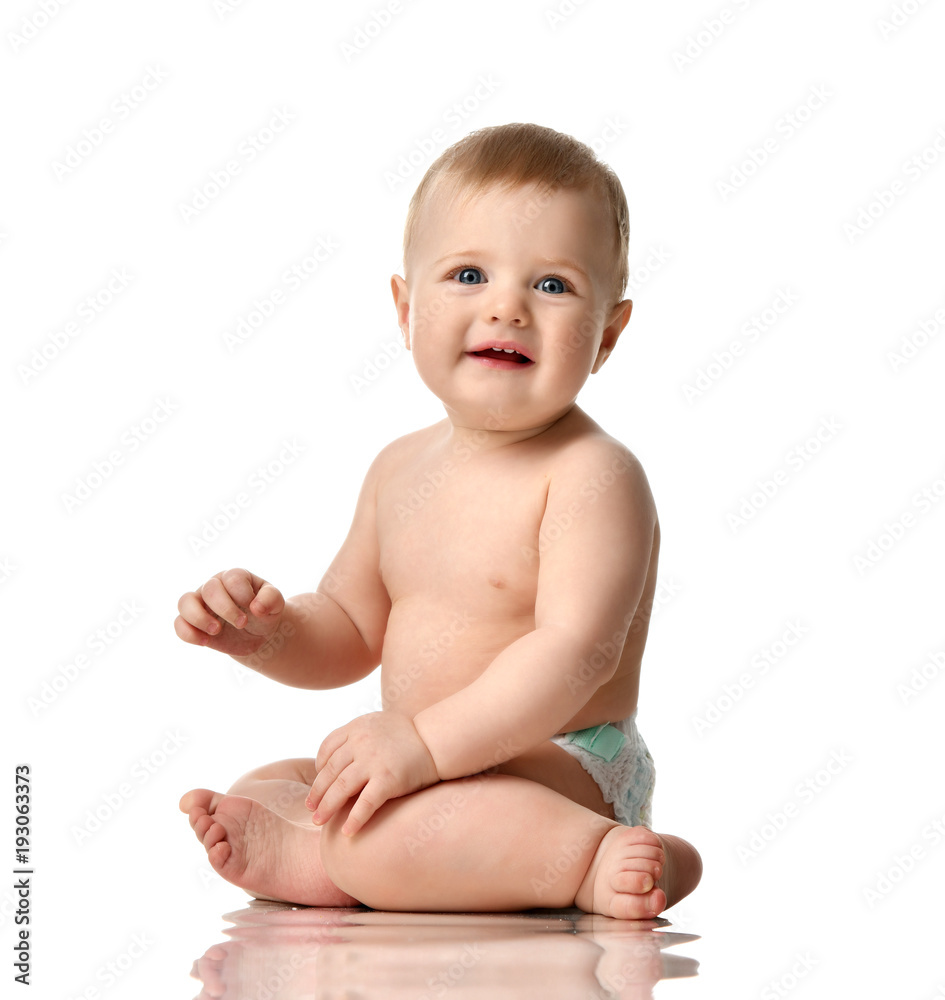 Infant child boy toddler in diaper sitting happy smiling Infant child boy toddler in diaper sitting happy smiling