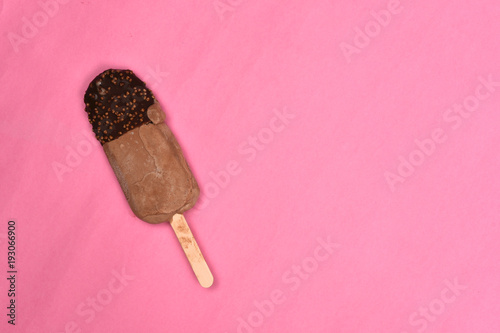 chocolate flavored ice cream isolated on pink background. sweet food concept