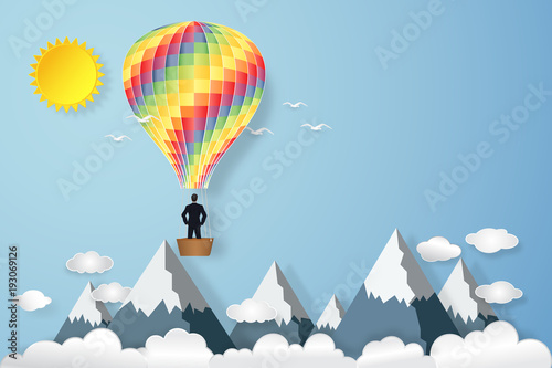 Businessman in the colorful hot air balloon and sunny under blue sky as paper art, craft style and business new year start up concept. vector illustration.