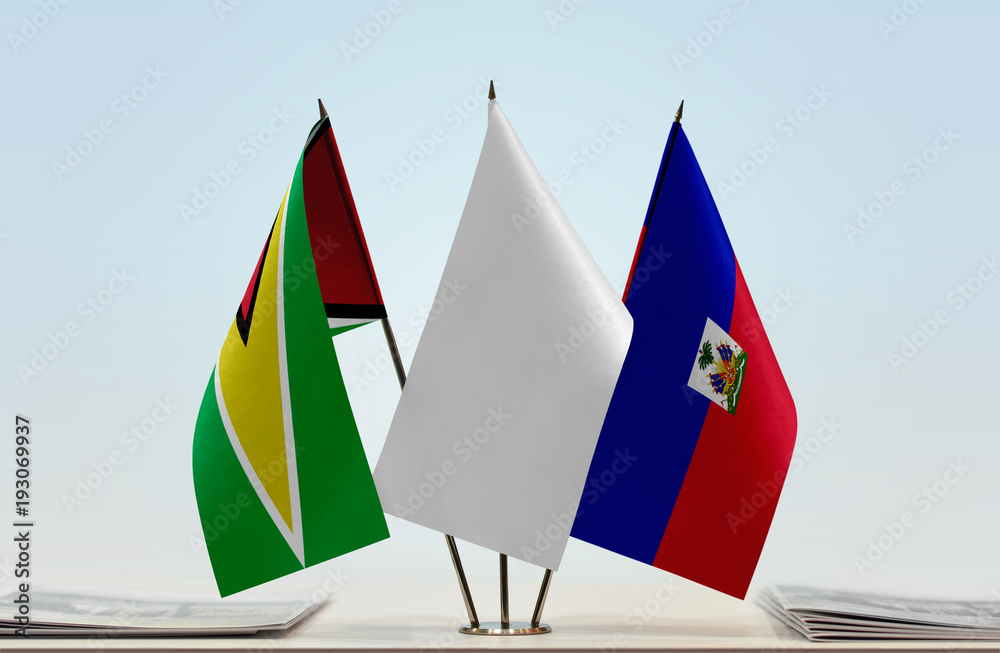 Flags of Guyana and Haiti with a white flag in the middle