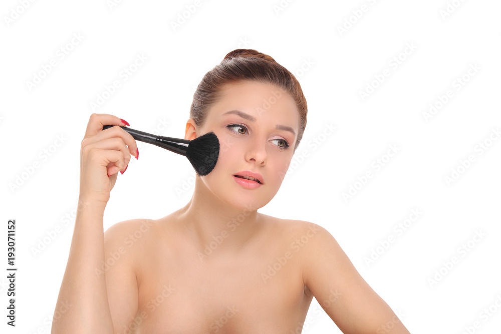 woman applying dry cosmetic powder woman applying dry cosmetic powder