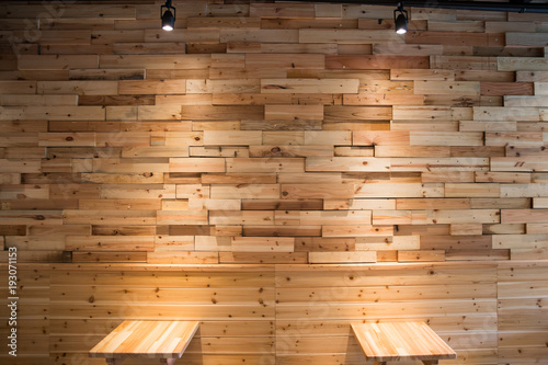 Planks brown wooden panel wall with two dimming downlight lights