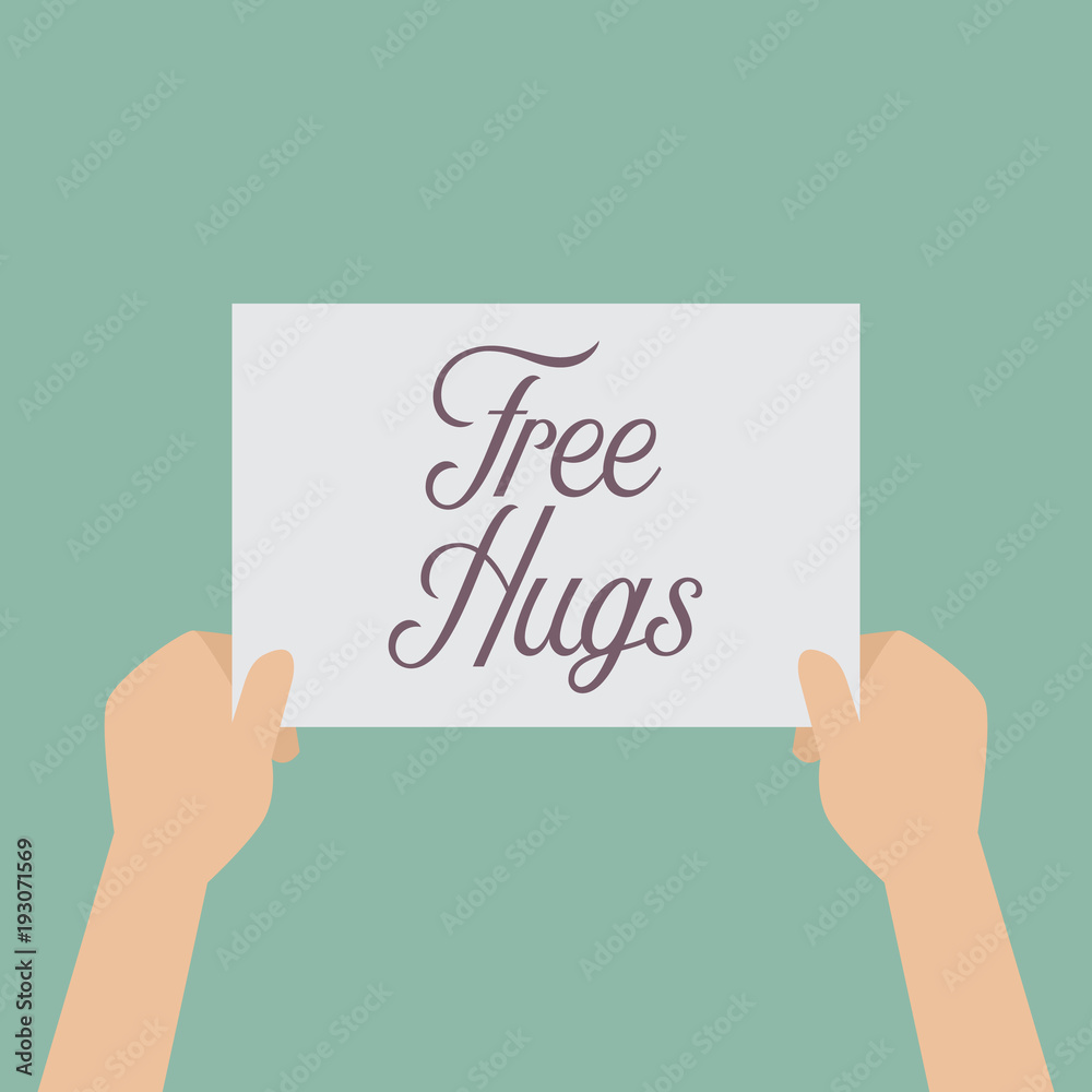 Hands holding a Free hugs sign Hands holding a Free hugs sign