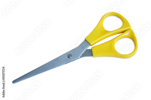 metal scissors with yellow plastic handles on a white background