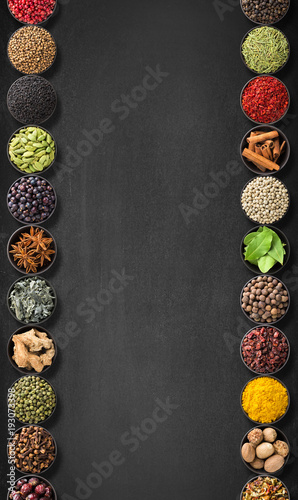 Fototapeta Naklejka Na Ścianę i Meble -  seasoning on a black table with empty space