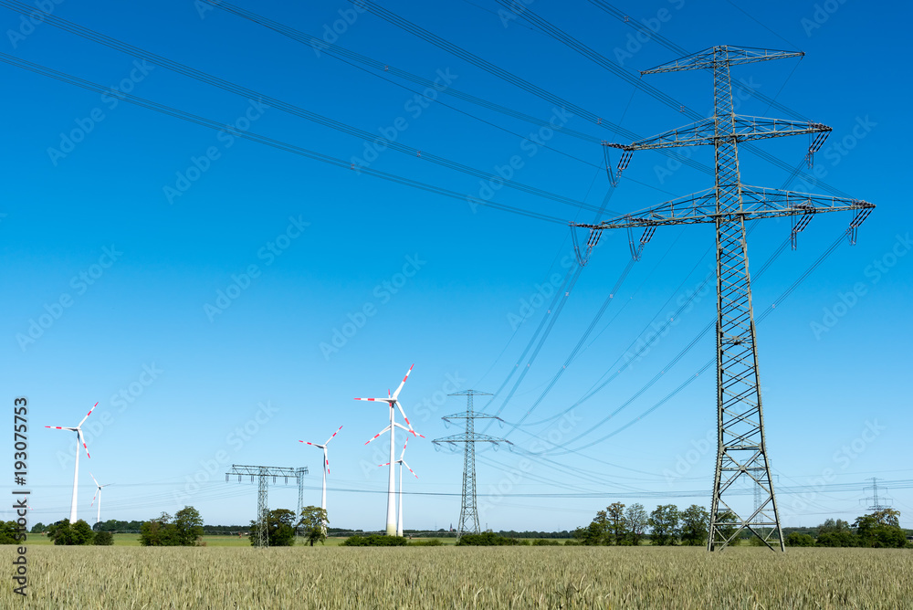 Windwheels and power transmission lines seen in rural Germany