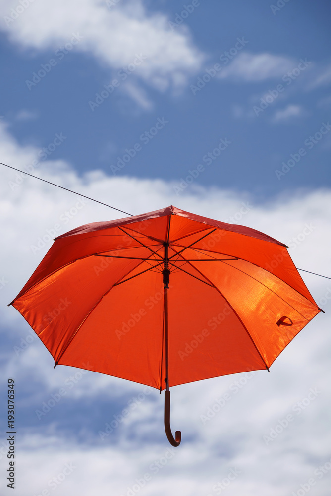 umbrella flying on a blue sky