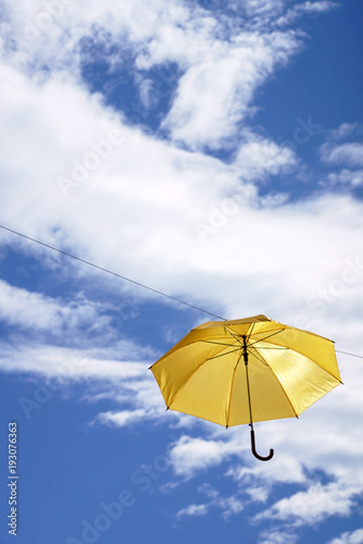 umbrella flying on a blue sky