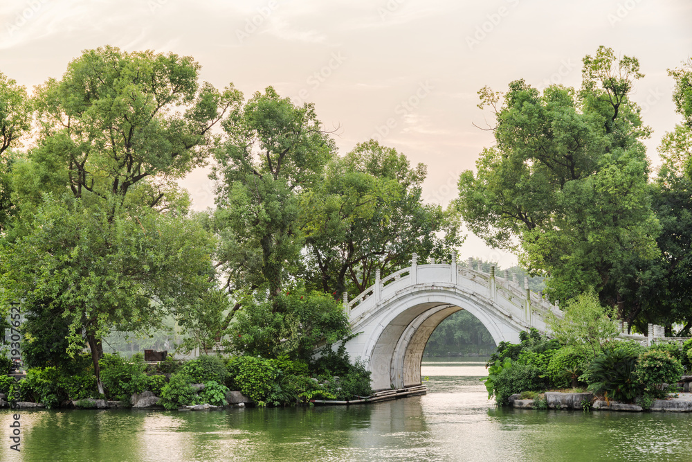 Evening view of white twin marble bridge on lake, Guilin