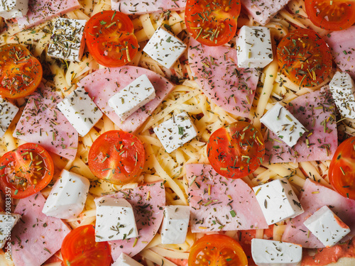 Pizza macro texture background with cherry ham cheese greens