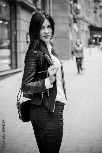 Shopping business woman in a city,Europe city streets . Lady in morern suit wearing fashionable clothes , concept of sale and shopping, outdoors.   © T.Den_Team