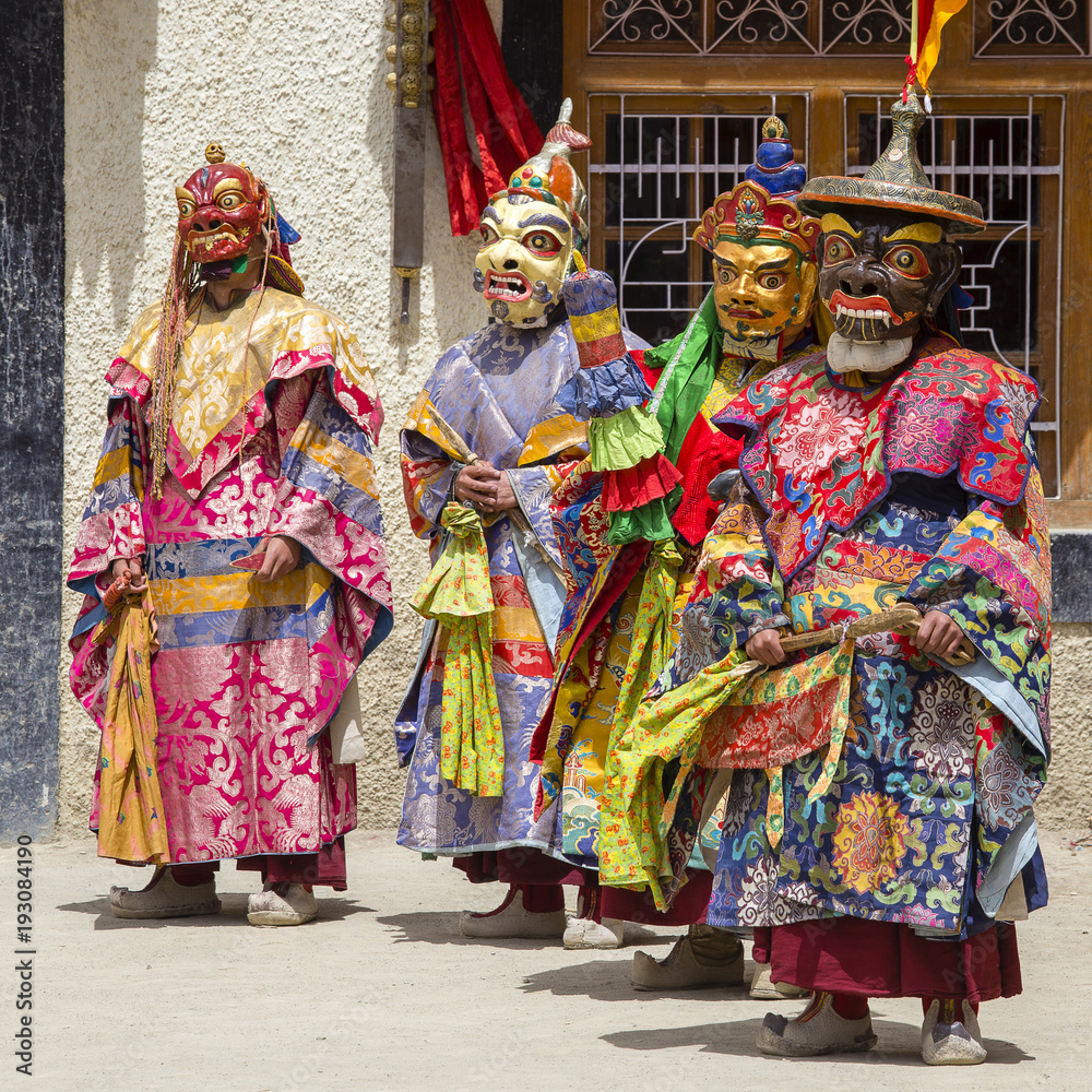 Fototapeta premium Buddhist lamas dressed in mystical mask dancing Tsam mystery dance in time of Yuru Kabgyat Buddhist festival at Lamayuru Gompa, Ladakh, North India
