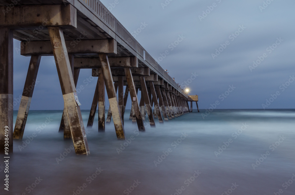 Pier in the ocean dramatic landscape scene
