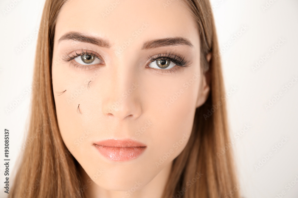 Young woman with eyelash loss problem on white background Young woman with eyelash loss problem on white background