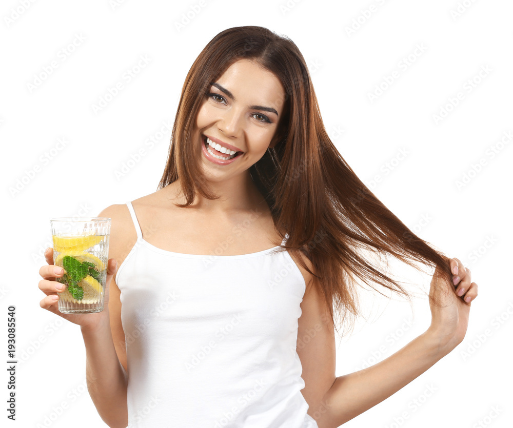 Beautiful young woman with glass of lemonade on white background Beautiful young woman with glass of lemonade on white background