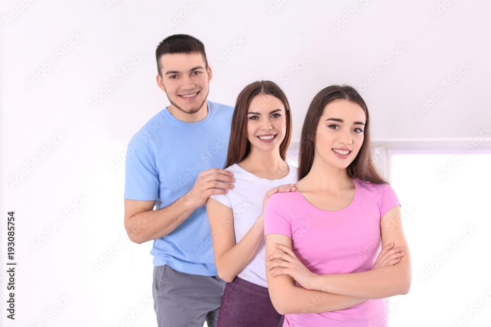 Young people posing together indoors. Unity concept Young people posing together indoors. Unity concept