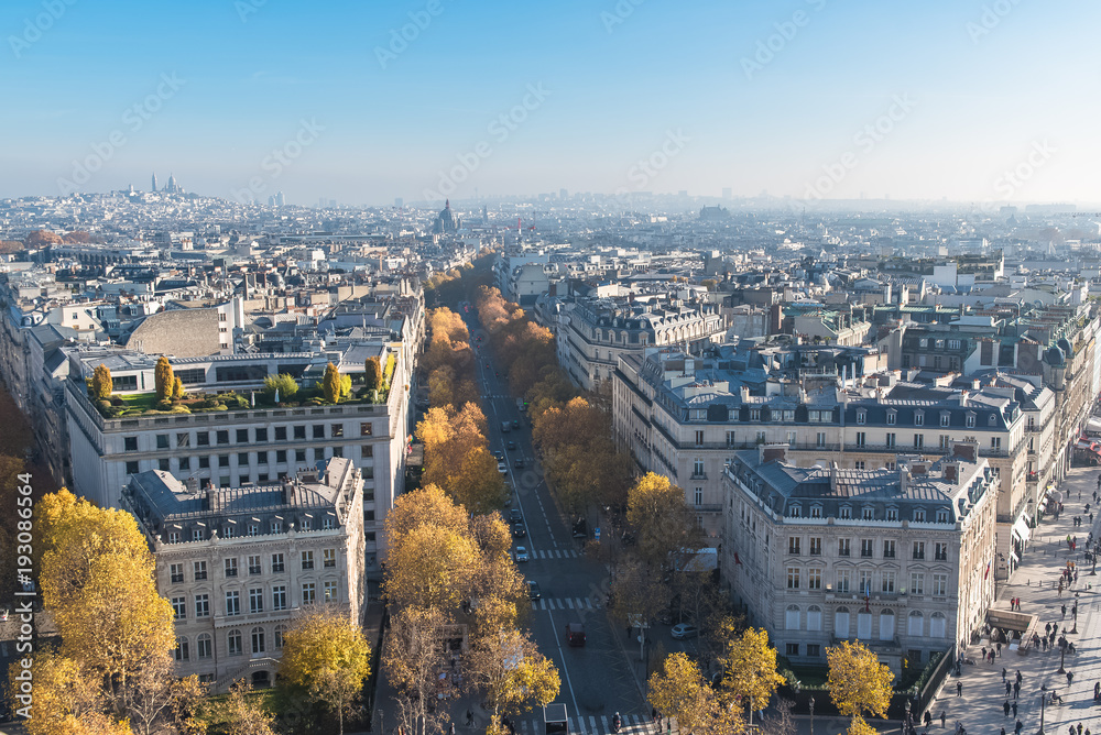 Paris, panorama from the Arc de Triomphe, aerial view, beautiful buildings avenue de Friesland, Saint-Augustin church and the Sacre Coeur in background


