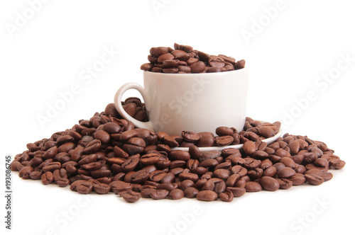 Coffee beans and a white cup on white background