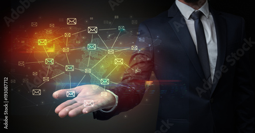 Wallpaper Mural Businessman holding communication symbols Torontodigital.ca