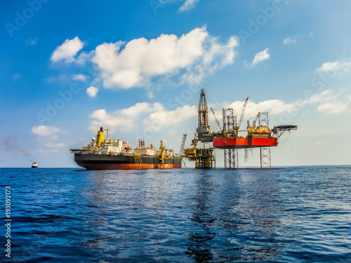 Offshore facility in oil industry construction, there are drilling rig, platform and FPSO tanker ship.