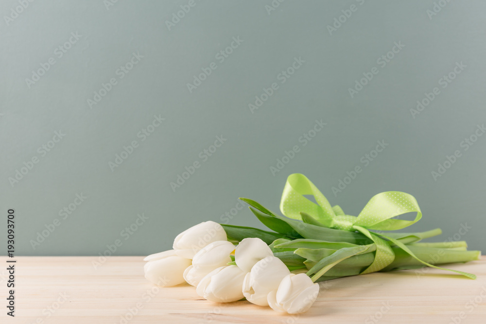 Tender white tulips in bunch