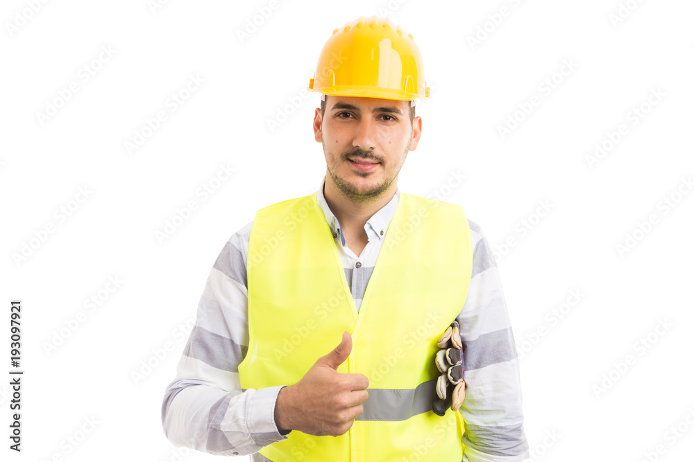 Young and handsome hardhat worker showing thumbsup.