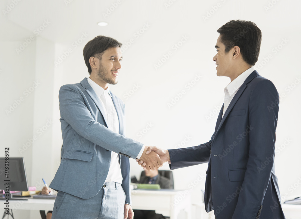 Businessmen making handshake agreement. concept finishing up a meeting. Businessmen making handshake agreement. concept finishing up a meeting.