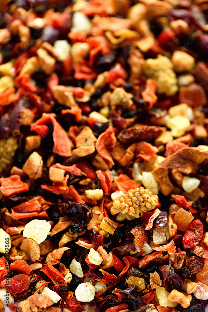 Mix tea karkade with dried fruits and flowers. Fruit tea background and texture. Top view. Food background. Organic healthy herbal leaves, detox tea. Mix tea karkade with dried fruits and flowers. Fruit tea background and texture. Top view. Food background. Organic healthy herbal leaves, detox tea.