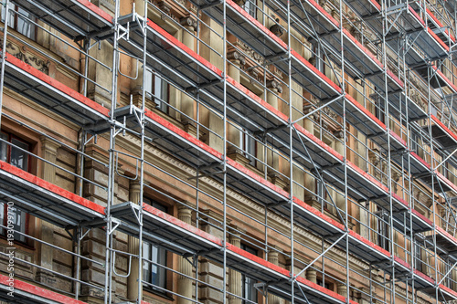 Obraz na plátně scaffolding around the house - historical building facade renovation