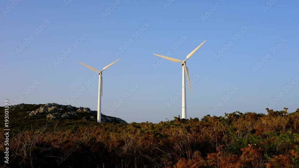 Wind turbines create renewable energy at the rural countryside landscape Wind turbines create renewable energy at the rural countryside landscape