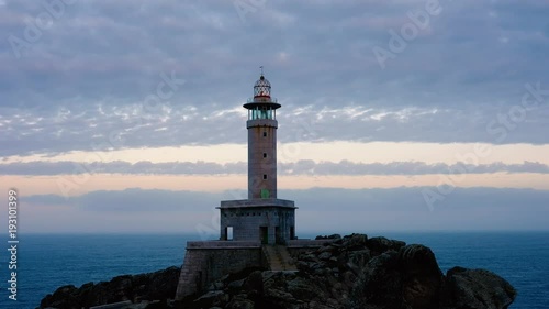 Punta Nariga Lighthouse in Spain at twilight photo