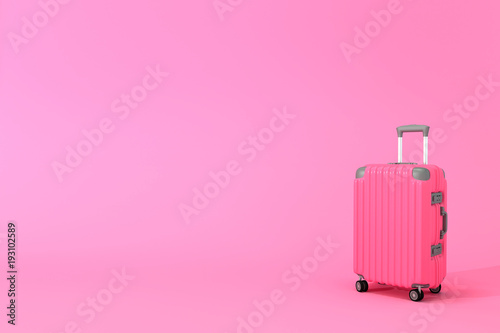 Luggage on pink background with copy space. minimal concept