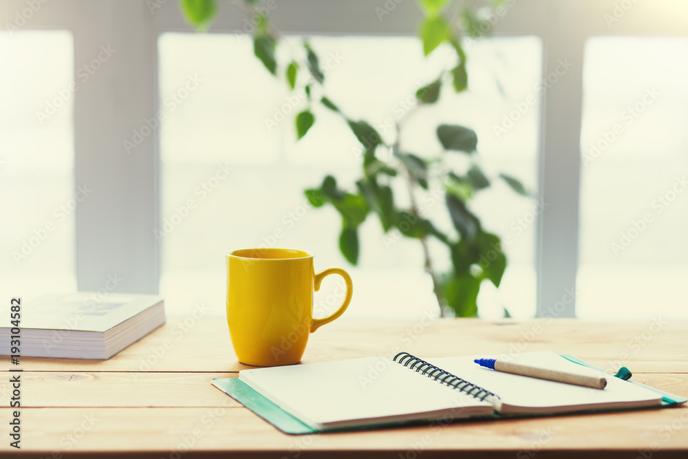 workplace, wooden table next to a large window workplace, wooden table next to a large window
