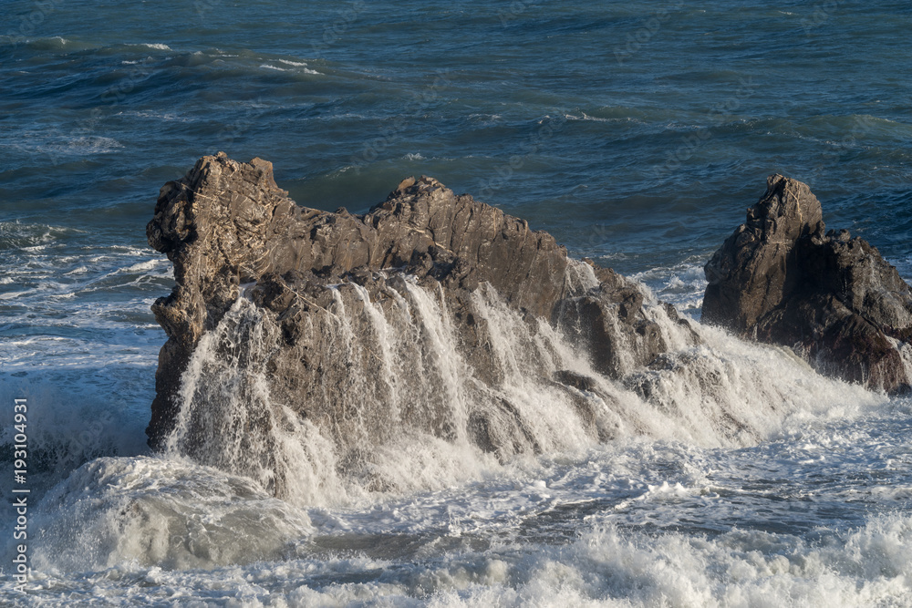 Mediterranean sea. Italy. Splashing waves against rocks