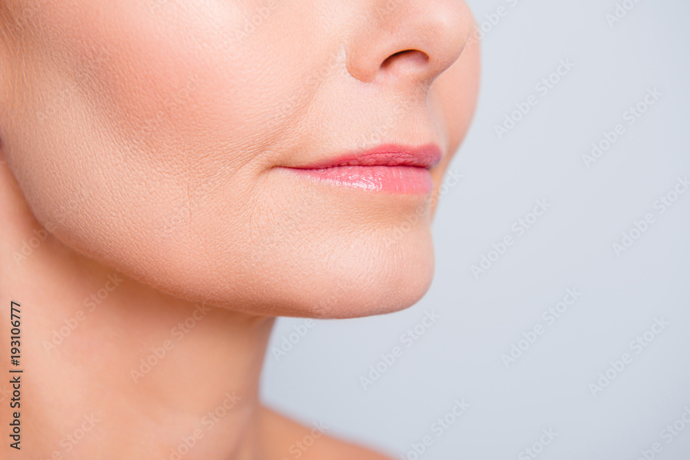 Perfect natural lip maqullage. Close up macro cropped photo with beautiful attractive female mouth, wellness, wellbeing, treatment, therapy concept, isolated on grey background