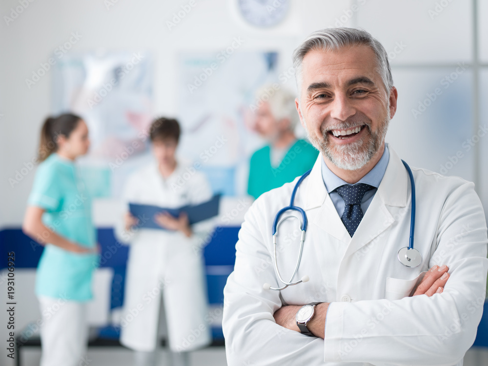 Confident doctor posing at the hospital Confident doctor posing at the hospital