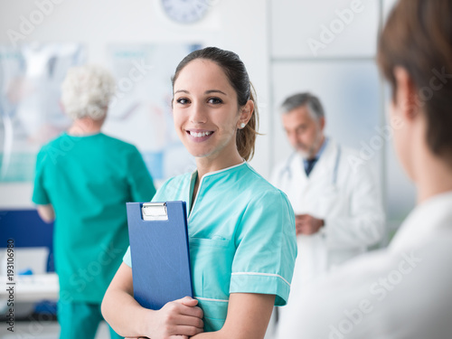 Young nurse working at the hospital photo