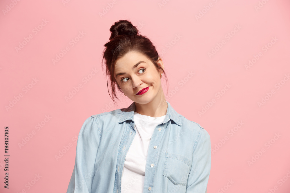Let me think. Doubtful pensive woman with thoughtful expression making choice against pink background Let me think. Doubtful pensive woman with thoughtful expression making choice against pink background
