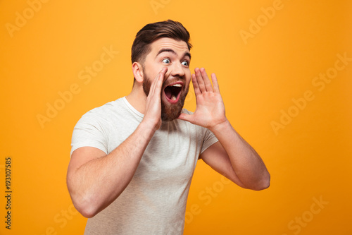 Portrait of an excited bearded man shouting