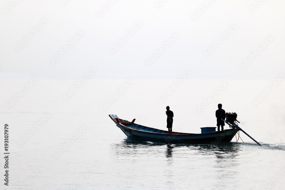 Silhouette of the long tail boat with local people while running Silhouette of the long tail boat with local people while running