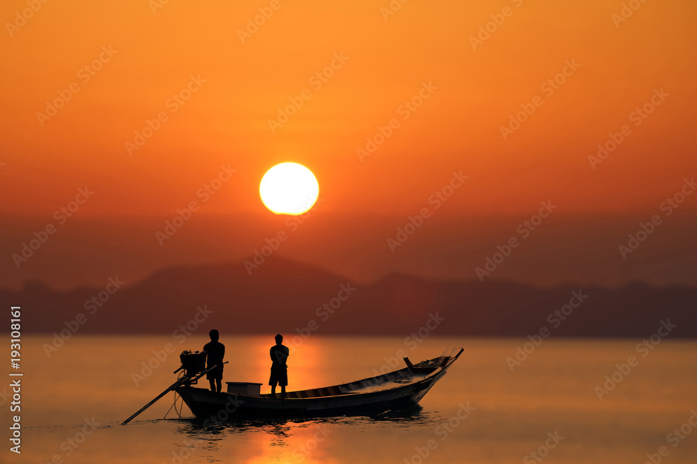Silhouette of the long tail boat with red sunset sky.