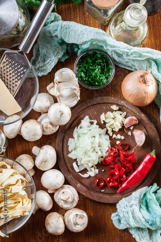 Ingredients ready for prepare tagliatelle pasta with champignon