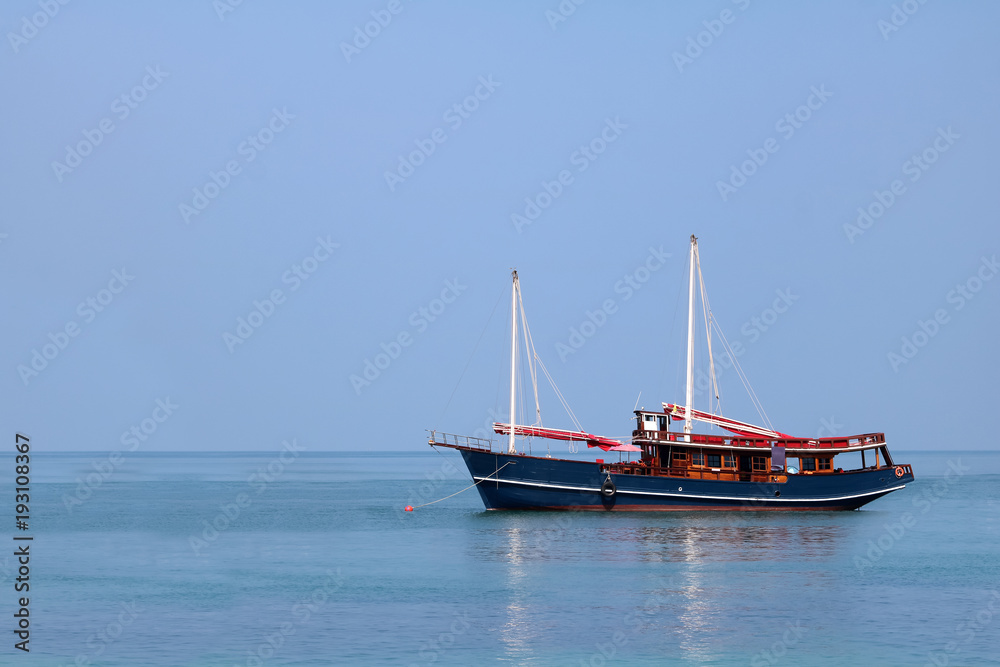 Traditional wooden sailboat in the sea