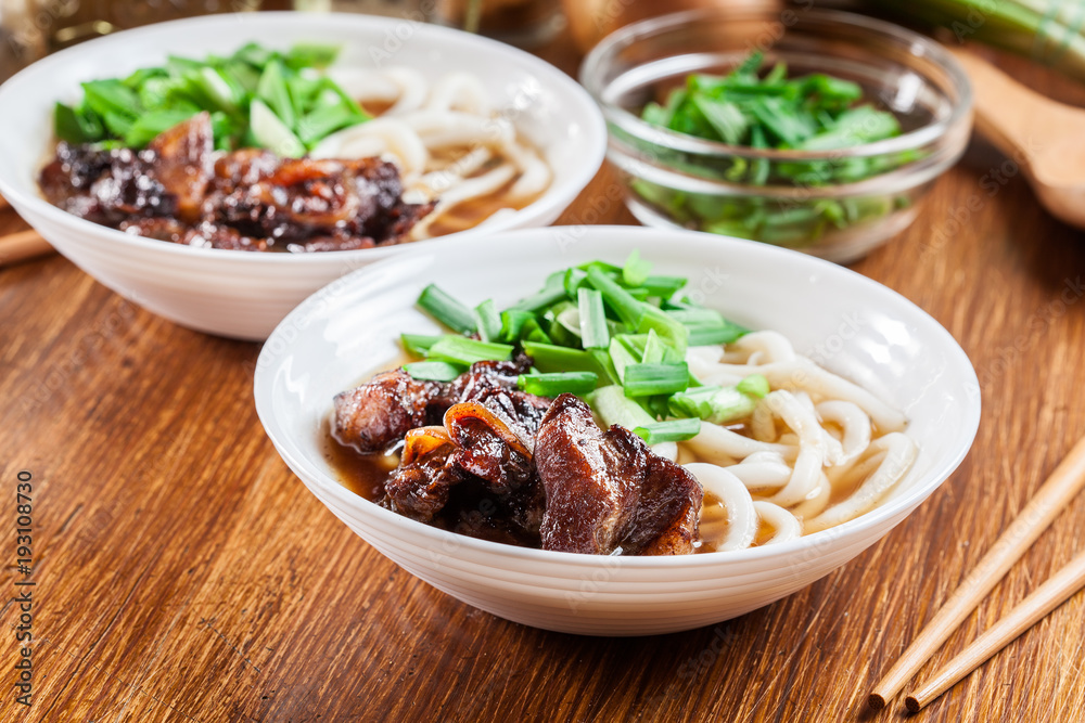 Japanese Udon noodles with beef, green onion and soup Japanese Udon noodles with beef, green onion and soup