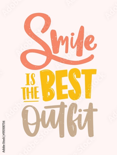 Smile Is the Best Outfit inscription handwritten with elegant calligraphic cursive font