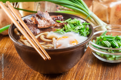 Vászonkép Japanese Udon noodles with beef, egg, green onion and soup